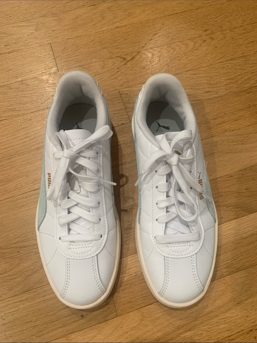 Puma White Sneakers with Light Blue Accent